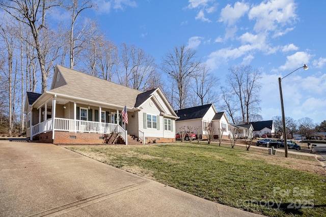 view of front facade with a front lawn and a porch