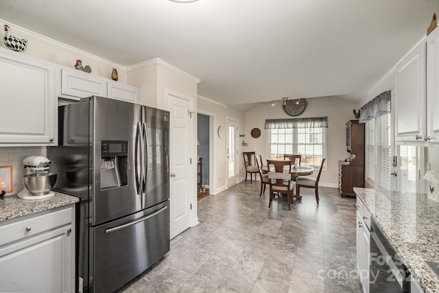 kitchen featuring tasteful backsplash, crown molding, light stone countertops, appliances with stainless steel finishes, and white cabinets