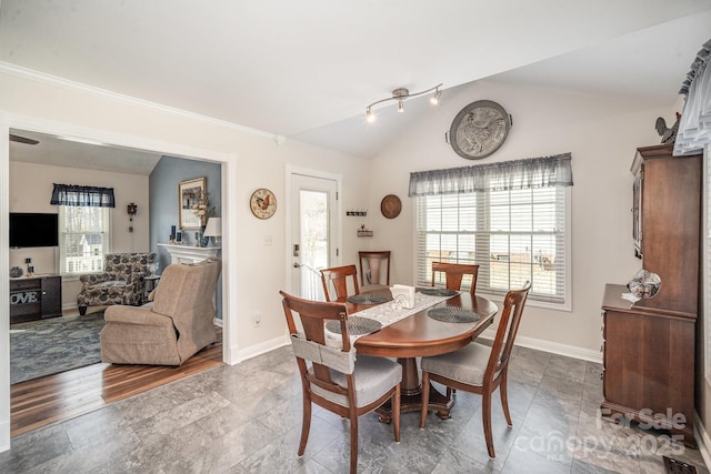 dining area with lofted ceiling