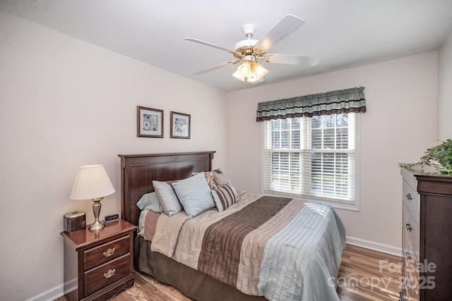 bedroom featuring light wood-type flooring and ceiling fan