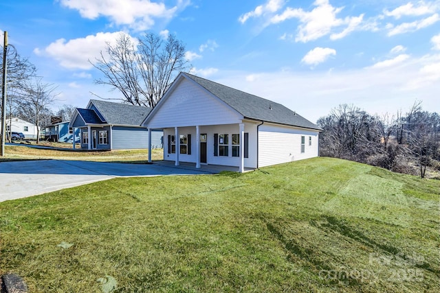 rear view of house with a lawn