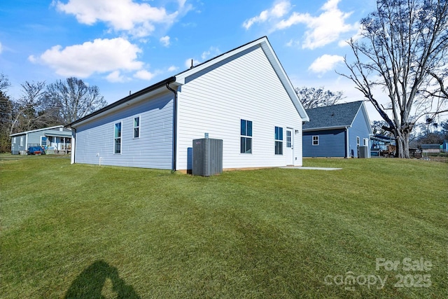 back of property with a yard and cooling unit