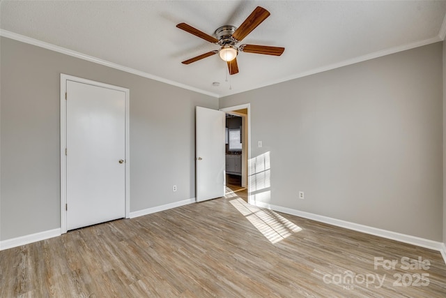 unfurnished bedroom with light wood-type flooring, ceiling fan, and crown molding