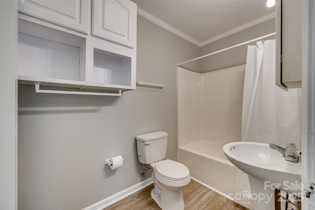 full bathroom with toilet, sink, crown molding, hardwood / wood-style flooring, and shower / bath combo with shower curtain