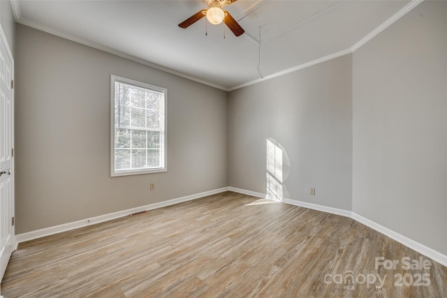 unfurnished room with crown molding and light hardwood / wood-style floors