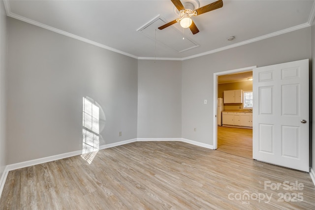 empty room with ceiling fan, ornamental molding, and light hardwood / wood-style flooring