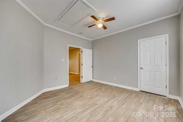 unfurnished bedroom with ceiling fan, crown molding, and light wood-type flooring