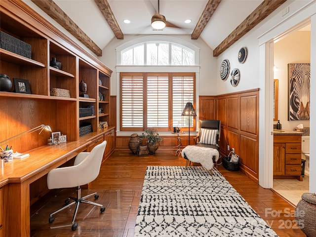 home office featuring hardwood / wood-style floors, vaulted ceiling with beams, and plenty of natural light