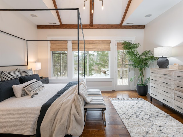 bedroom with beam ceiling, dark hardwood / wood-style flooring, access to outside, and multiple windows