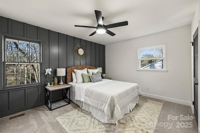 carpeted bedroom with ceiling fan