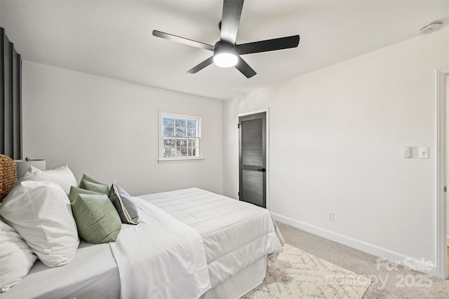 bedroom featuring ceiling fan and light colored carpet