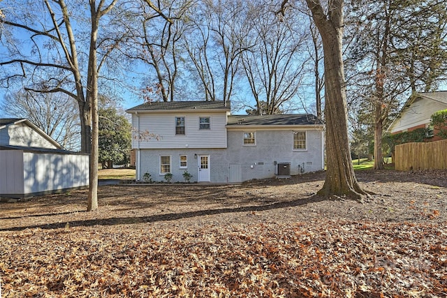 rear view of property featuring cooling unit