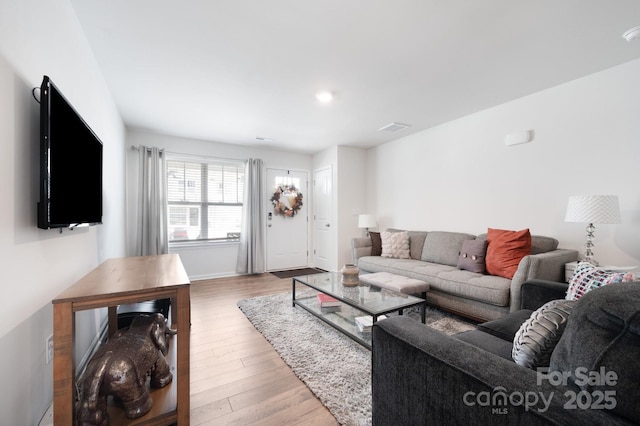 living room with hardwood / wood-style flooring