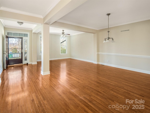 interior space with a wealth of natural light, hardwood / wood-style floors, ceiling fan, and ornamental molding