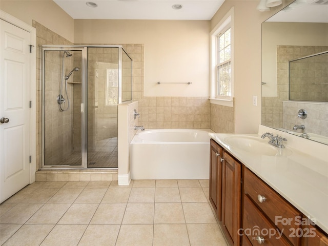 bathroom featuring vanity, separate shower and tub, and tile patterned floors