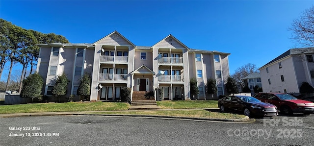 view of property featuring a front yard