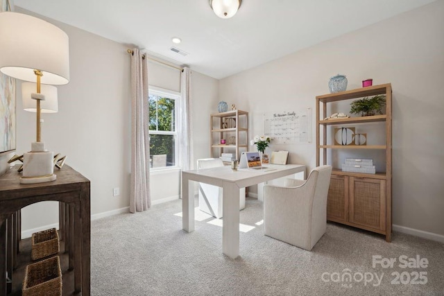 office area featuring light colored carpet