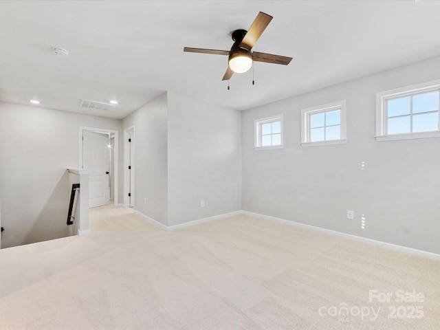 carpeted empty room with ceiling fan