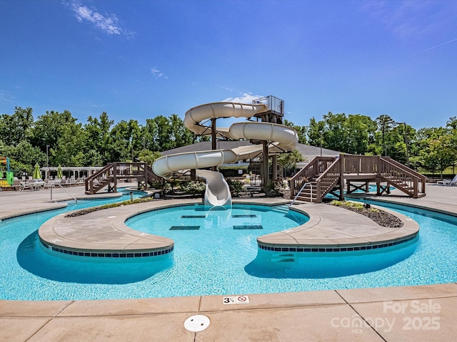 view of pool featuring a water slide