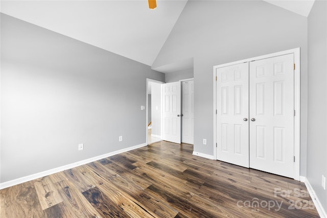 unfurnished bedroom with high vaulted ceiling, ceiling fan, and dark hardwood / wood-style floors