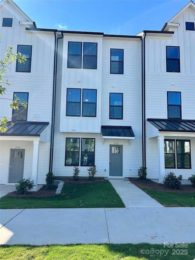 15310 Ballancroft Pkwy Unit 20, Charlotte, NC 28277 - view of front of house with board and batten siding, a standing seam roof, and metal roof