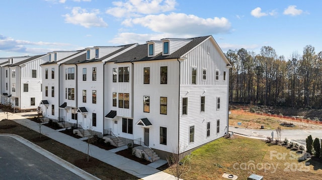 15310 Ballancroft Pkwy Unit 20, Charlotte, NC 28277 - townhome / multi-family property with board and batten siding and roof with shingles