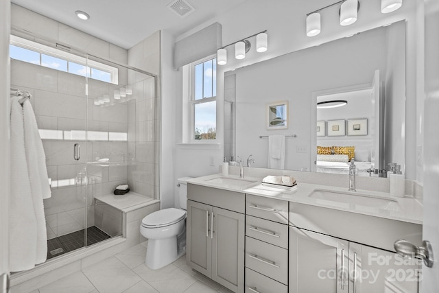 15310 Ballancroft Pkwy Unit 20, Charlotte, NC 28277 - ensuite bathroom with double vanity, a shower stall, toilet, and recessed lighting