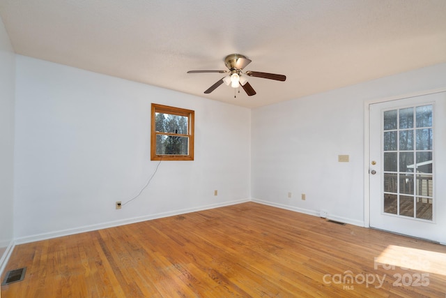 unfurnished room with ceiling fan and light hardwood / wood-style flooring