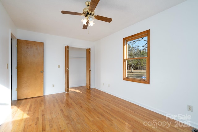 unfurnished bedroom featuring ceiling fan and light hardwood / wood-style floors