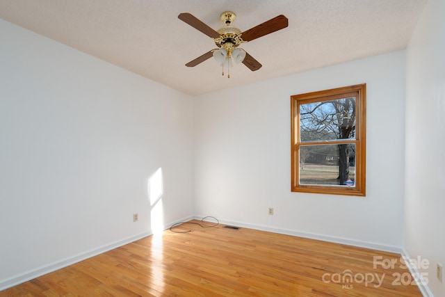 unfurnished room featuring ceiling fan and light hardwood / wood-style floors