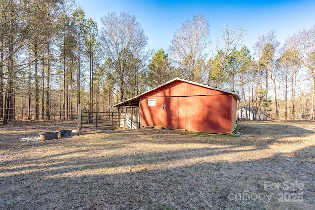 view of outbuilding with a yard