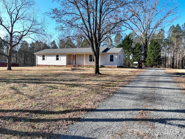 ranch-style house with a front yard