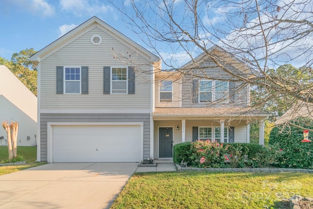 view of front of house with driveway, an attached garage, and a front yard