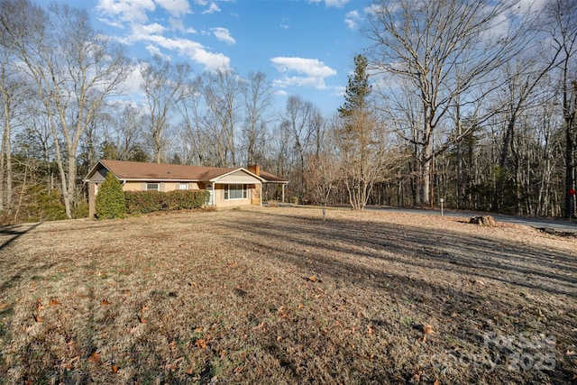 exterior space featuring a front yard