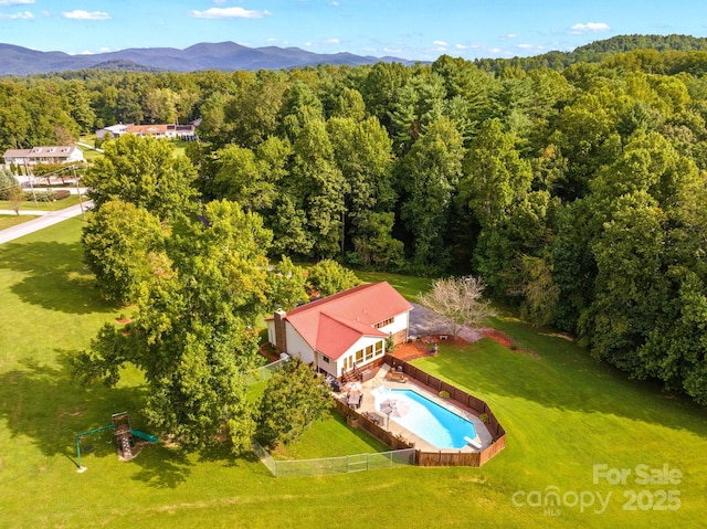 birds eye view of property featuring a mountain view