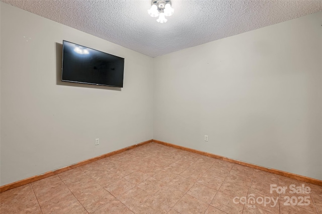 empty room featuring a textured ceiling