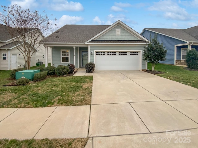 view of front facade featuring a garage and a front lawn