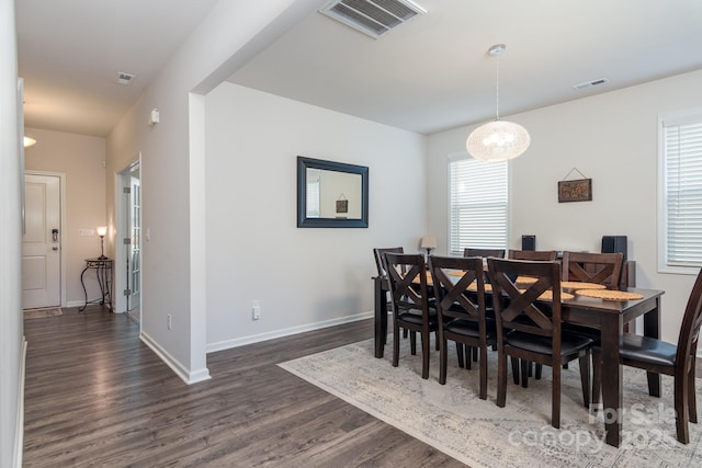 dining area featuring dark hardwood / wood-style floors