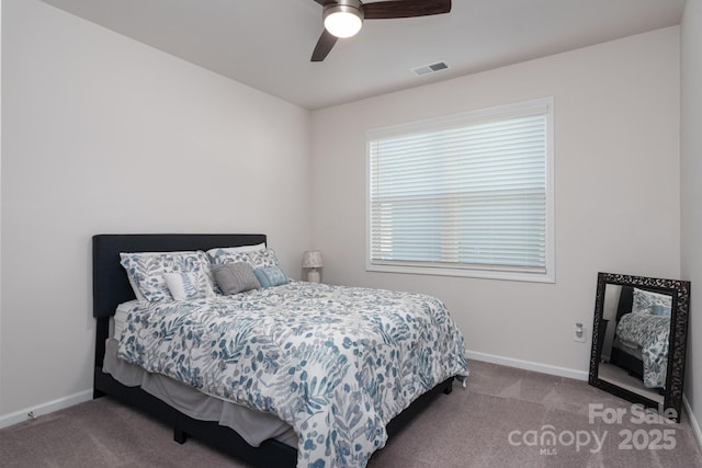 carpeted bedroom with ceiling fan