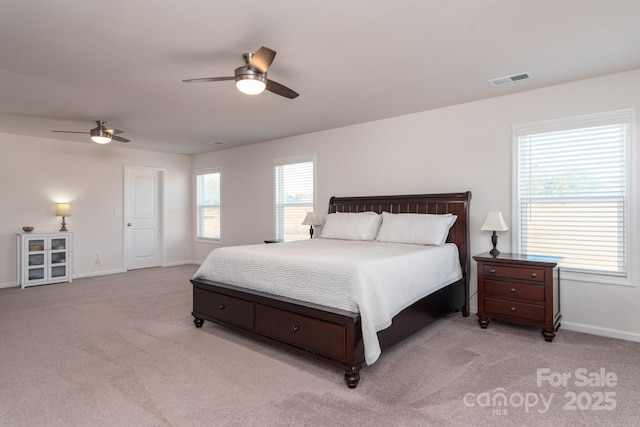 carpeted bedroom with ceiling fan