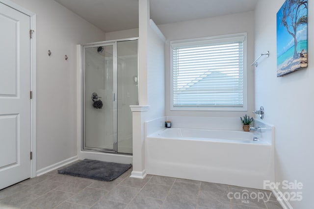 bathroom featuring independent shower and bath