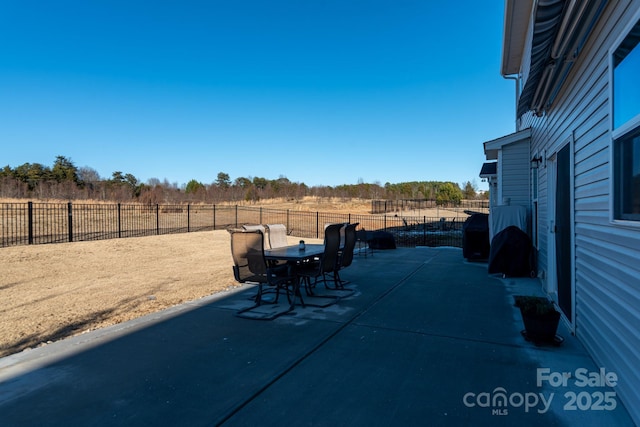 view of patio with a rural view