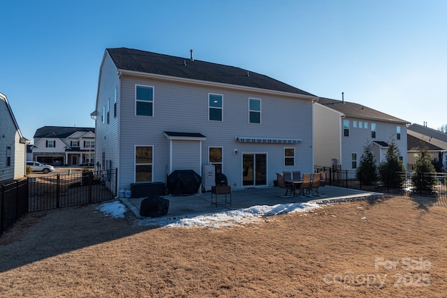 rear view of property featuring a patio