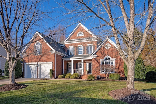 front of property featuring a porch, a front lawn, and a garage