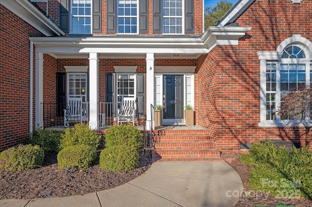 property entrance with covered porch