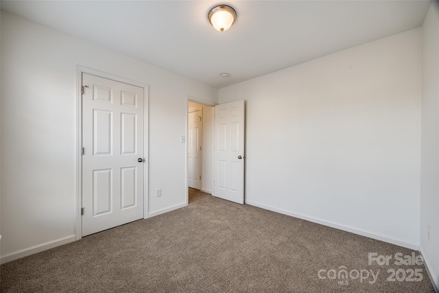 unfurnished bedroom with carpet flooring