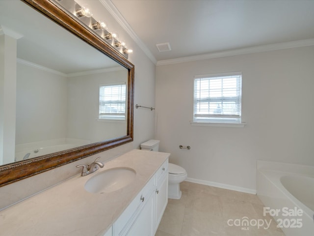 bathroom with toilet, crown molding, vanity, a tub, and tile patterned flooring