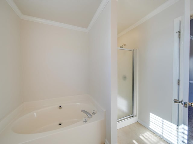 bathroom featuring independent shower and bath, crown molding, and tile patterned flooring