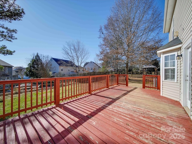 wooden deck with a yard