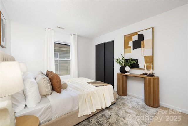 bedroom featuring light colored carpet